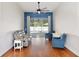 A cozy living room with pool view, features elegant seating and stylish decor at 1034 Alvina Ln, Oviedo, FL 32765