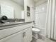 Bathroom with a shower-tub combo and a vanity with modern fixtures at 1077 Leader St, Davenport, FL 33896
