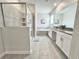 Bathroom featuring a tub and shower, double vanity, and modern fixtures at 1077 Leader St, Davenport, FL 33896
