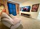 This bedroom features a decorative brick wall and Avengers decor at 1077 Leader St, Davenport, FL 33896