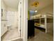 Charming bedroom, featuring a bunk bed and an ensuite bathroom at 1077 Leader St, Davenport, FL 33896