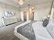 This bedroom features a modern chandelier, gray and white decor at 1077 Leader St, Davenport, FL 33896