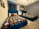 Themed bedroom with blue beds, Star Wars decor, and stylish accents at 1077 Leader St, Davenport, FL 33896
