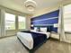 Bright bedroom with contemporary lighting, and lots of natural light at 1077 Leader St, Davenport, FL 33896