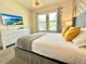 Comfortable bedroom featuring a plush bed, ample natural light, and a large dresser at 1077 Leader St, Davenport, FL 33896