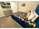 Cozy bedroom with Star Wars themed decor, television, and blue plush bed frame at 1077 Leader St, Davenport, FL 33896