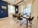 Elegant dining area with contemporary furnishings and stylish lighting for a sophisticated dining experience at 1077 Leader St, Davenport, FL 33896