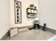 Cozy coffee bar area featuring a coffee maker, shelving, and decorative signs on the countertop at 1077 Leader St, Davenport, FL 33896