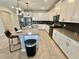 Bright kitchen showcasing white cabinets, subway tile backsplash, and a large island with seating at 1077 Leader St, Davenport, FL 33896