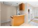 Home bar area featuring sink, wine rack, and access to the backyard at 11 Huntley Ct, Haines City, FL 33844