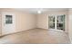 Bedroom featuring carpet floors, natural light, and view to the backyard at 11 Huntley Ct, Haines City, FL 33844