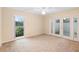Bright bedroom with access to the backyard through sliding glass doors at 11 Huntley Ct, Haines City, FL 33844