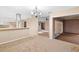 Open-concept room with modern lighting, tiled floors, and seamless transitions to the adjoining spaces at 11 Huntley Ct, Haines City, FL 33844