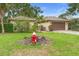 Charming single-story home with a well-maintained lawn and mature landscaping at 11 Huntley Ct, Haines City, FL 33844