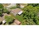 Aerial view shows roofline, fenced yard, green space, and patio cover at 1301 Paradise Ln, Winter Park, FL 32792