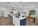 Spacious kitchen with a large island, stainless steel appliances, and an open view to the living area at 1301 Paradise Ln, Winter Park, FL 32792