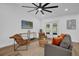 Well-lit living room featuring stylish seating, a mounted TV, and elegant decor at 1301 Paradise Ln, Winter Park, FL 32792