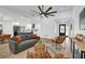 Spacious living room with open layout, seamlessly connected to a modern kitchen and dining area at 1301 Paradise Ln, Winter Park, FL 32792