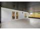 Large, screened-in patio featuring white tile flooring and entry doors to inside of house at 1301 Paradise Ln, Winter Park, FL 32792