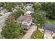 Aerial view of the home showcasing the property's landscaping, driveway, and surrounding neighborhood at 141 Dommerich Dr, Maitland, FL 32751