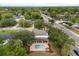 Aerial view of the home showcasing the pool, outdoor living space, landscaping, and neighborhood at 141 Dommerich Dr, Maitland, FL 32751