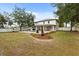 Expansive backyard featuring a pool, patio with seating, and well-maintained lawn at 141 Dommerich Dr, Maitland, FL 32751