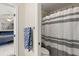Bathroom featuring black and white shower curtain and towel bar near the shower at 141 Dommerich Dr, Maitland, FL 32751