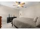 Comfortable bedroom with soft carpet, modern ceiling fan, and neutral colors at 141 Dommerich Dr, Maitland, FL 32751