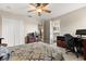 Neutral bedroom featuring a ceiling fan, closet, and desk workspace with a computer at 141 Dommerich Dr, Maitland, FL 32751