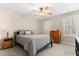 Cozy bedroom with neutral decor, ceiling fan, and natural light at 141 Dommerich Dr, Maitland, FL 32751