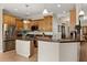 Well-lit kitchen with stainless steel appliances and beautiful wood cabinetry at 141 Dommerich Dr, Maitland, FL 32751