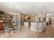 Spacious kitchen with stainless steel appliances, custom cabinetry, and a breakfast bar overlooking the breakfast nook at 141 Dommerich Dr, Maitland, FL 32751