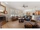 Spacious living room with a fireplace, hardwood floors, and an open concept design for entertaining at 141 Dommerich Dr, Maitland, FL 32751