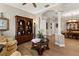 Elegant living room featuring hardwood floors, decorative columns, and an open floor plan to the dining area at 141 Dommerich Dr, Maitland, FL 32751