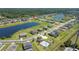 Serene community aerial view featuring homes, lakes, green spaces, and a pool at 14537 San Lorenzo Dr, Orlando, FL 32820