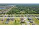 A community featuring beautiful water views amidst a backdrop of trees and well-spaced homes at 14537 San Lorenzo Dr, Orlando, FL 32820
