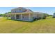 Expansive backyard featuring a covered patio perfect for relaxing and enjoying the outdoor space at 14537 San Lorenzo Dr, Orlando, FL 32820