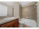 Neutral bathroom with a combination shower and tub, tile surround, and vanity at 14537 San Lorenzo Dr, Orlando, FL 32820