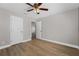 Bedroom with wood floors, neutral paint, a ceiling fan, and plenty of natural light at 14537 San Lorenzo Dr, Orlando, FL 32820