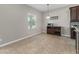 Cozy dining area with a wine rack and neutral colors, adjacent to the kitchen at 14537 San Lorenzo Dr, Orlando, FL 32820