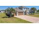 Beautiful home featuring a paved driveway, two-car garage and a manicured lawn at 14537 San Lorenzo Dr, Orlando, FL 32820