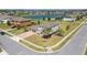 Beautiful two-story home with a well-manicured lawn and brick driveway near a tranquil lake at 14537 San Lorenzo Dr, Orlando, FL 32820