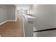 Hallway with wood flooring and a view of the staircase at 14537 San Lorenzo Dr, Orlando, FL 32820