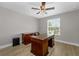Spacious office with plenty of natural light and a nice wood desk with chair at 14537 San Lorenzo Dr, Orlando, FL 32820