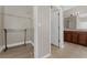 Walk-in closet adjacent to a bathroom, providing ample storage space with wire shelving and room for organization at 14537 San Lorenzo Dr, Orlando, FL 32820