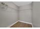 Spacious walk-in closet features wire shelving and wood-look vinyl flooring at 14537 San Lorenzo Dr, Orlando, FL 32820