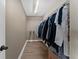 Walk-in closet with wood flooring and plenty of hanging storage at 14537 San Lorenzo Dr, Orlando, FL 32820