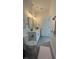 Bright bathroom with a dual sink vanity, modern fixtures, wood-look flooring, and a framed mirror at 16734 Sw 18Th Avenue Rd, Ocala, FL 34473