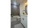 Modern bathroom featuring a tub-shower combo with gray tile, a vanity with a white countertop, and sleek black fixtures at 16734 Sw 18Th Avenue Rd, Ocala, FL 34473