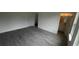 Unfurnished bedroom with light gray flooring, neutral walls, and two bright windows at 16734 Sw 18Th Avenue Rd, Ocala, FL 34473